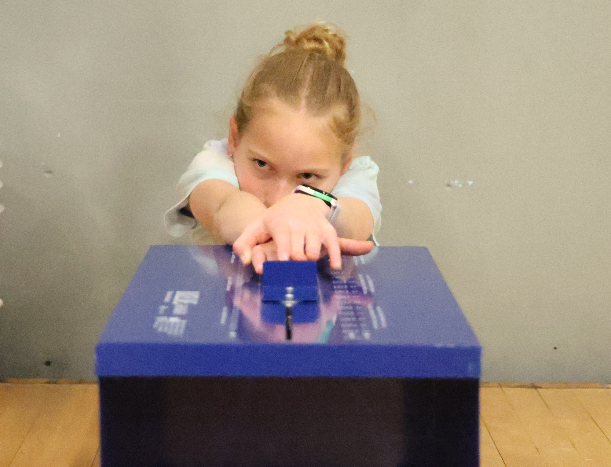 A young athlete using a machine to test flexibility.