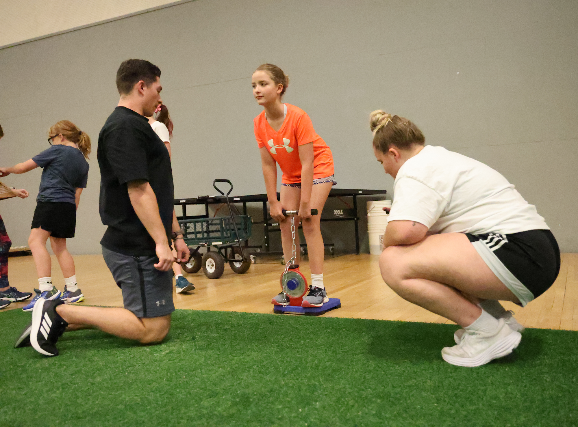 A young athlete tests their thigh pull strength. 